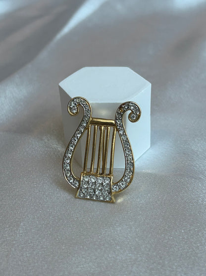Broche vintage atypique note de musique et strass