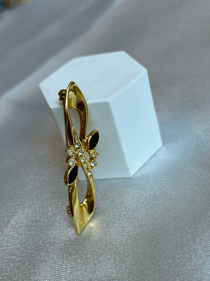 Broche vintage doré à strass et pierre noir signé D