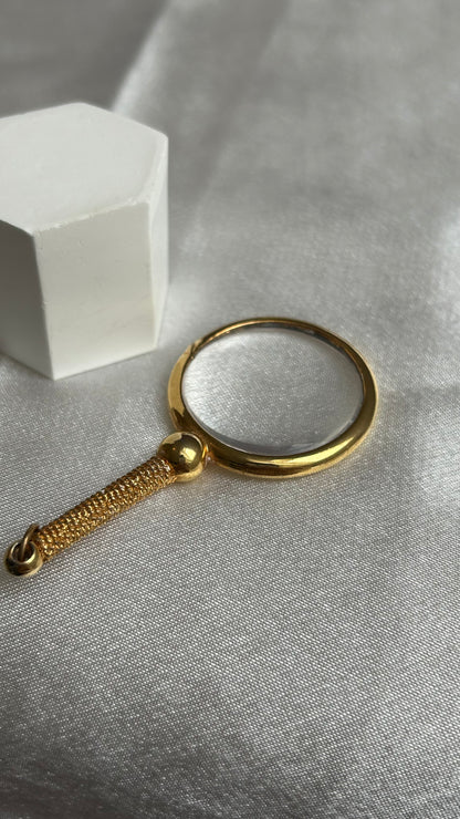 Pendentif très atypique doré loupe