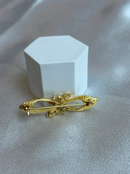 Broche vintage doré à strass et pierre noir signé D