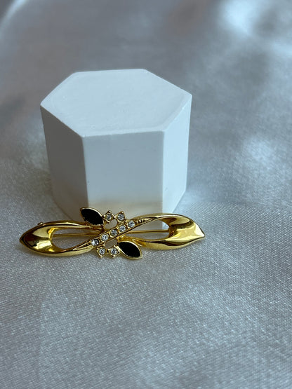 Broche vintage doré à strass et pierre noir signé D
