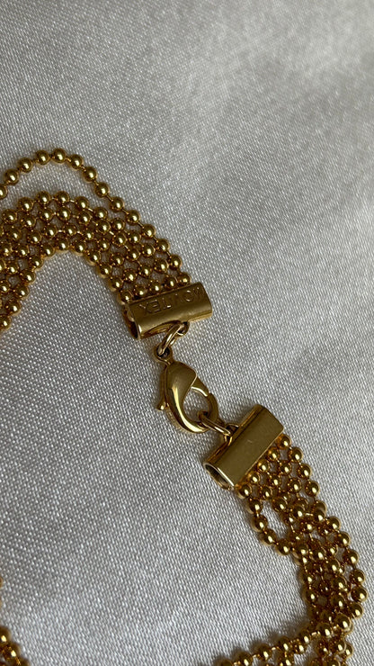 Bracelet vintage à boules d’or motivex